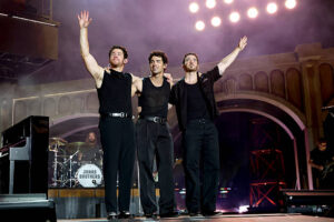 L-R) Nick Jonas, Joe Jonas, and Kevin Jonas brothers perform onstage. (Photo by Kevin Mazur/Getty Images for Live Nation)